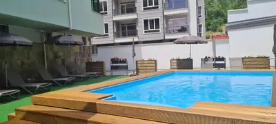 a swimming pool in the middle of a building at Perun Hotel Sandanski in Sandanski