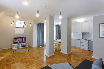 an open living room with a dining room and kitchen at Dunav Apartment House in Sofia