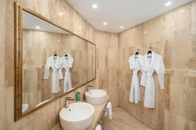 a bathroom with a sink and a mirror at Hotel VEGA Sofia in Sofia