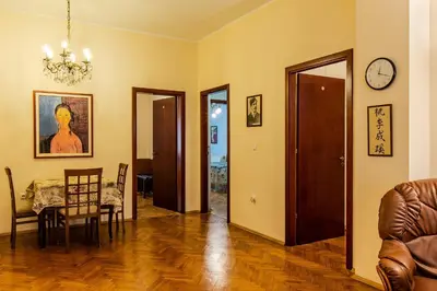 a living room with a table and a dining room at Casa Ferrari Bed & Breakfast in Sofia
