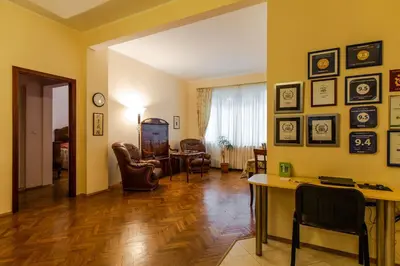 a living room with a table and chairs and a room at Casa Ferrari Bed & Breakfast in Sofia