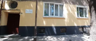 a yellow and blue building with a door and windows at Casa Ferrari Bed & Breakfast in Sofia