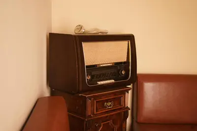 an old television sitting on top of a wooden table at My Guest Rooms in Plovdiv