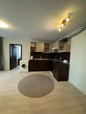 a large room with a kitchen and a washing machine at Apart Hotel Dream in Bansko