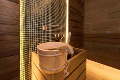 a bathroom with a bath tub with a shower at Lion Bansko Hotel in Bansko