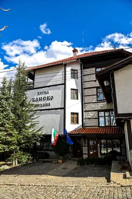 a building with a sign on the side of it at Family Hotel Bansko Sofia in Sofia