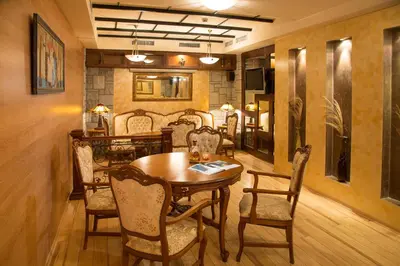 a dining room with a table and chairs at Hotel Gabi in Plovdiv