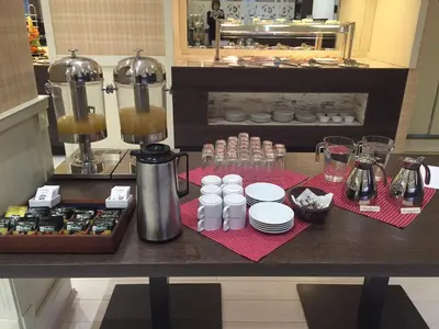 a counter top with a coffee maker and some food at Strimon Garden Medical SPA Hotel in Kyustendil