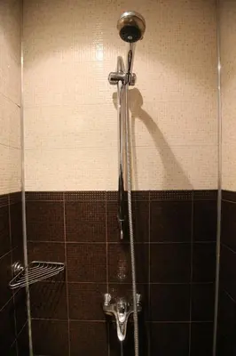 a shower stall in a bathroom with a toilet at Hotel & Restaurant The House in Sofia