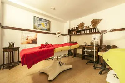 a room with a bed and a desk in it at Hotel Bansko SPA & Holidays - Free Parking in Bansko