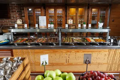 a buffet line with many different types of food at Katarino SPA Hotel in Bansko