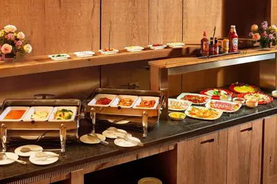 a buffet line with many different types of food at Metropolitan Hotel Sofia, a member of Radisson Individuals in Sofia