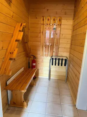 a wooden sauna with a bench and a ladder at Alpin Borovets, Алпин Боровец in Borovets