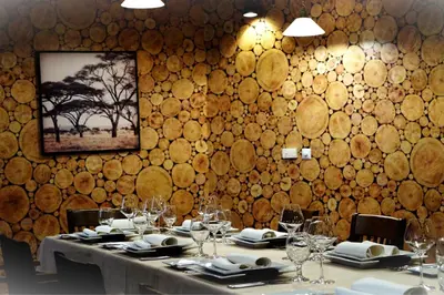 a dining room with a table with wine glasses at Triada Hotel in Sofia