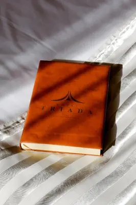 a book sitting on top of a table at Triada Hotel in Sofia