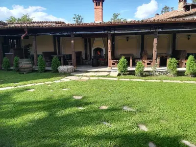 a house with a lawn in front of it at Once upon a time in Koprivshtitsa