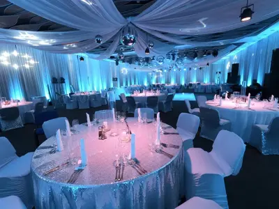 a large banquet hall with white tables and chairs at Grand Hotel Plovdiv in Plovdiv