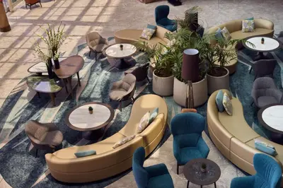 an overhead view of a restaurant with tables and chairs at Hilton Sofia in Sofia