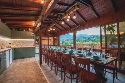 a long dining room with a long table and chairs at Duvaro Guesthouse in Raduil