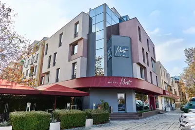 a building with a sign on the front of it at Monet Hotel in Plovdiv