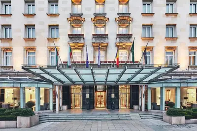 a facade of a building with a revolving door at Sofia Balkan Palace in Sofia