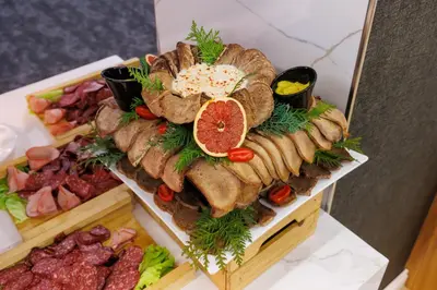 a platter of different types of food on a table at Vihren Royal Palace in Bansko
