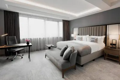 a hotel room with a bed and a desk and a chair at InterContinental Sofia by IHG in Sofia
