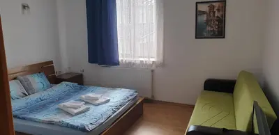 a small bedroom with a bed and a window at Villa Filip in Bachevo