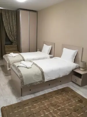 a bedroom with two beds at Apartment Park Sveti Vrach in Sandanski