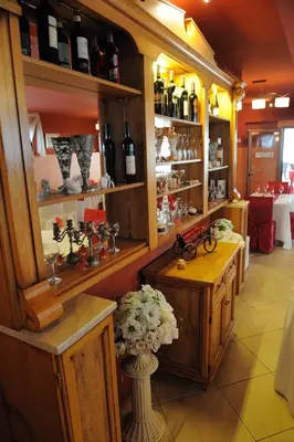 a wine shop with a bunch of bottles of wine at Hotel Racic Self-Check In in Voyvodinovo