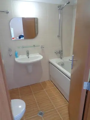 a bathroom with a sink and a tub and a toilet at Yastrebetz view in Borovets