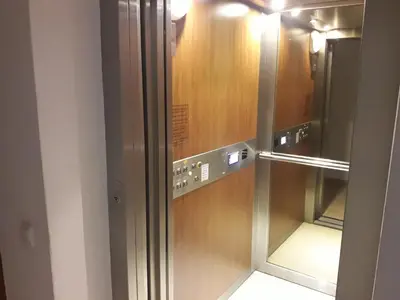 a elevator in a building with a glass door at Pirin Heights in Bansko