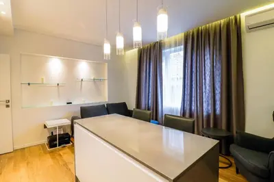 a meeting room with a table and chairs and a window at Lozenets Executive Apartment with Private Parking in Sofia