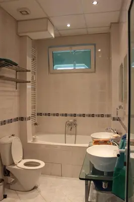 a bathroom with a toilet and a tub and a sink at Han Krum 2 Bedroom Central Flat in Sofia