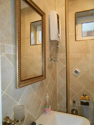 a bathroom with a mirror and a sink at Orient Express Guest House in Sofia