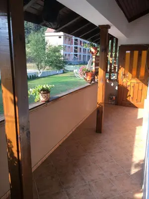 an open porch with a view of a garden at Villa Paradise in Beli Iskar