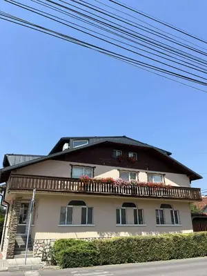 a large house with a balcony on top of it at Hotel Four Seasons in Samokov
