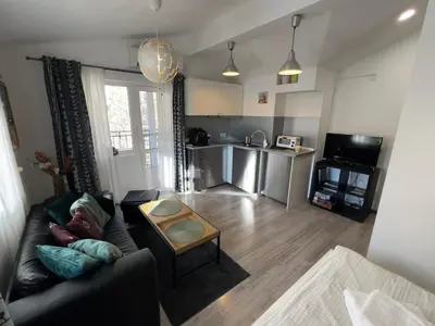 a living room with a couch and a table at The Yellow House in Sofia in Sofia