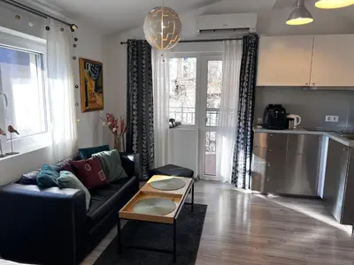 a living room with a couch and a table at The Yellow House in Sofia in Sofia