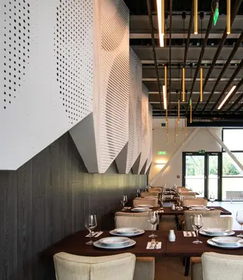a dining room with wooden tables and chairs at Euphoria Club Hotel in Borovets