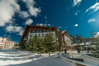a building in the snow in front at Euphoria Club Hotel in Borovets