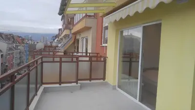 a balcony with a view of a city at Modern apartment Sofia center in Sofia