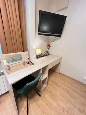 a desk with a television on top of it at Budapest Central Cozy Studio w Working Space and WiFi in Sofia