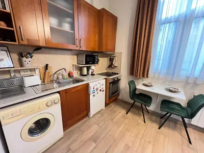 a kitchen with a sink and a washing machine at Budapest Central Cozy Studio w Working Space and WiFi in Sofia