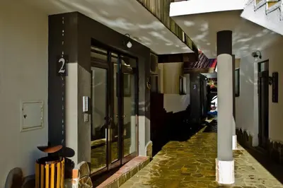 a store front with glass windows and a sidewalk at Apartment Biliana in Pamporovo