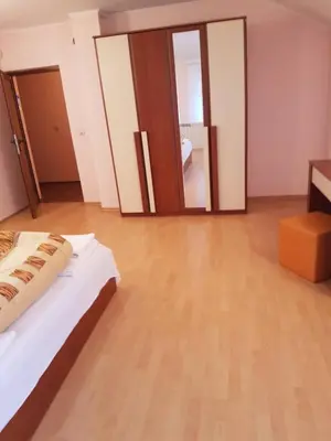 a bedroom with a bed and a large mirror at Guest House Iveta in Sofia