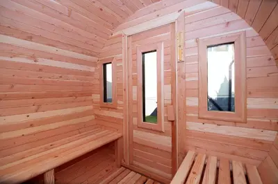 a wooden sauna with two windows in it at SPA Hotel Olymp in Velingrad