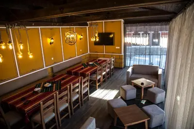 an overhead view of a dining room with tables and chairs at Red House in Koprivshtitsa