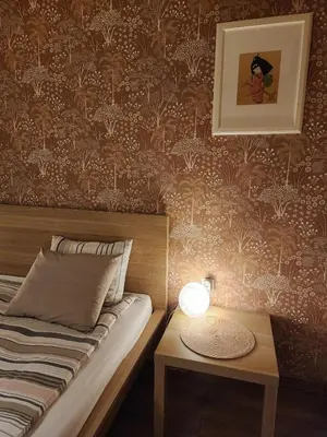 a bedroom with a bed and a table with a lamp at Sunny Central Apartment in Sofia