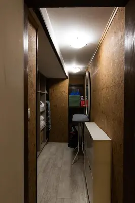 a room with a hallway with a table and a counter at Vintage Lozenets Apartment in Sofia